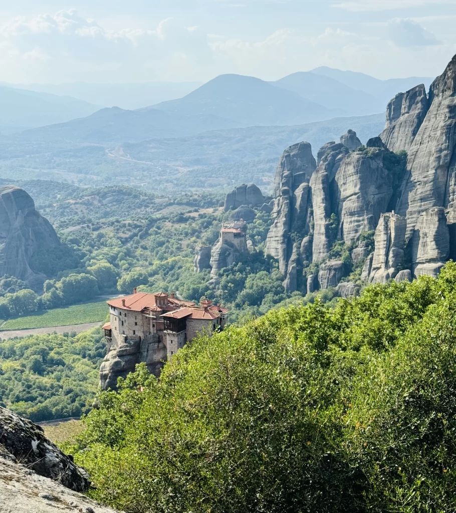 Looking down at a monastery from a viewpoint of a Meteor's in Greece.