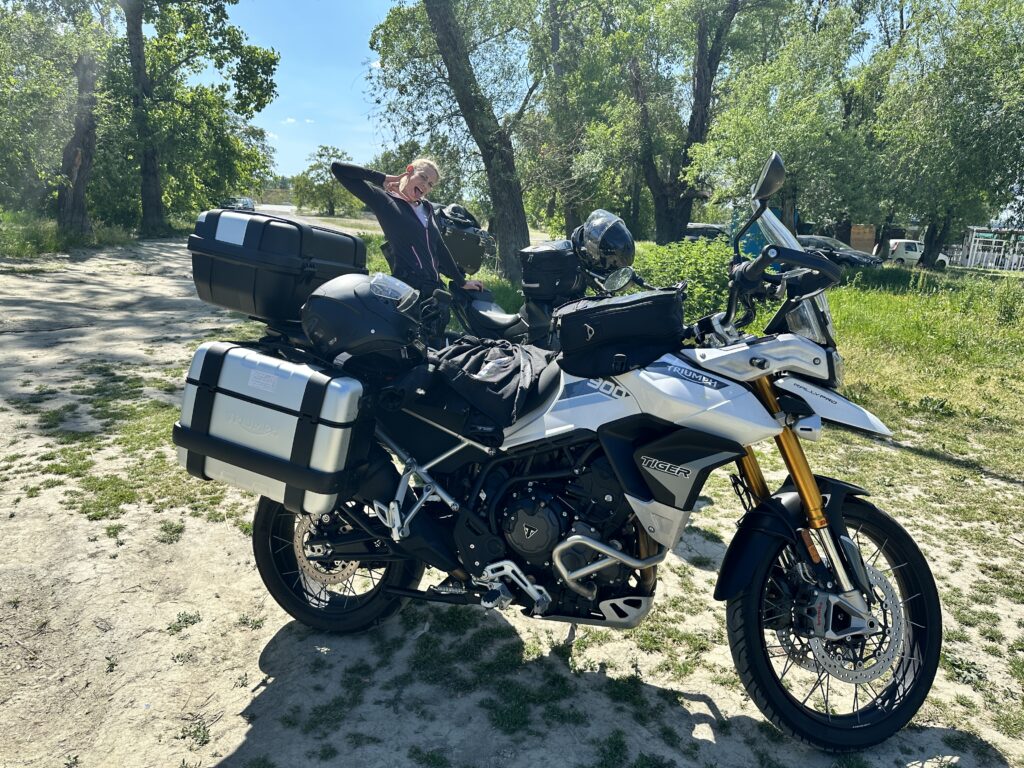 SophieS and the borrowed Triumph Tiger 900 Rally Pro parked up at the river side.