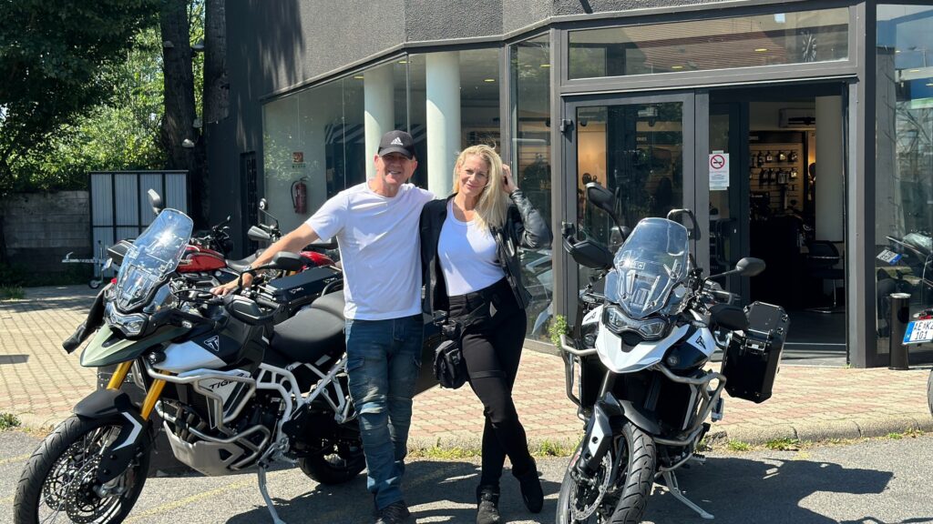 Rag and Sophie posing next to their new bikes in front of the Triumph dealer in Budapest.