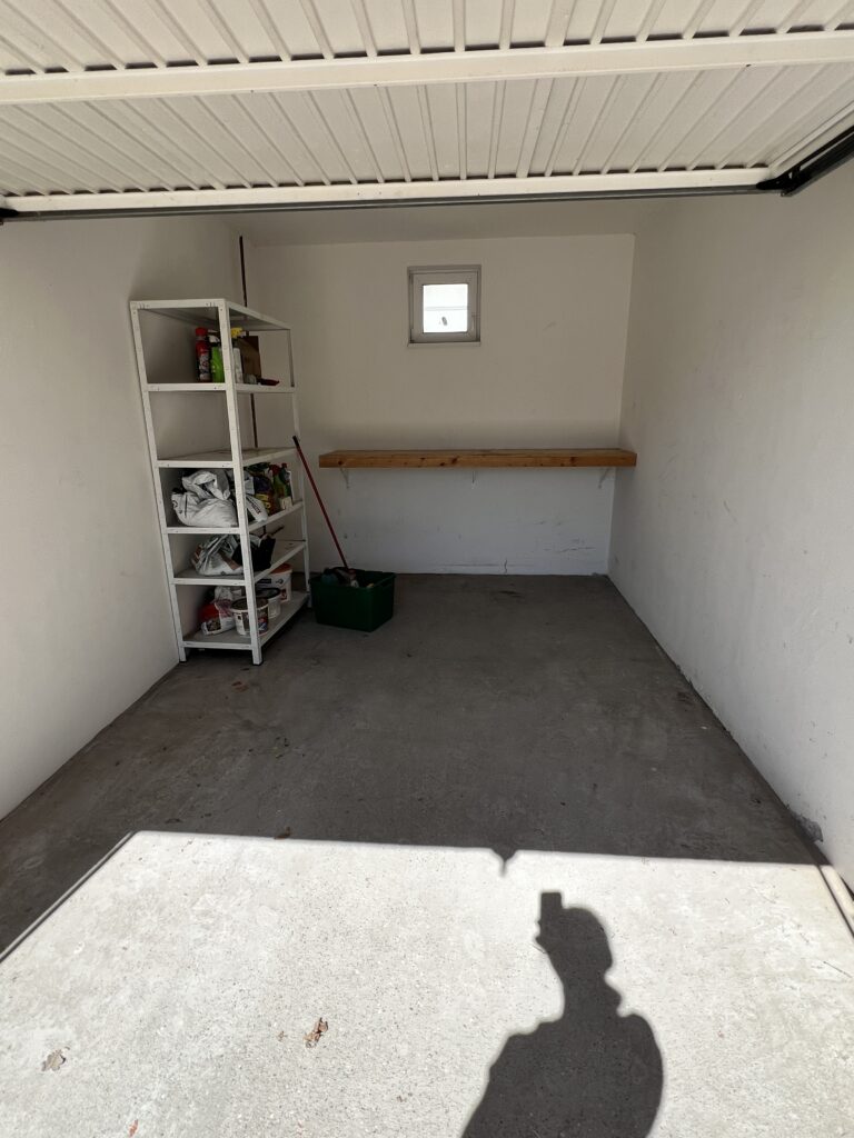 An empty garage after the garage sales, right before moving out.