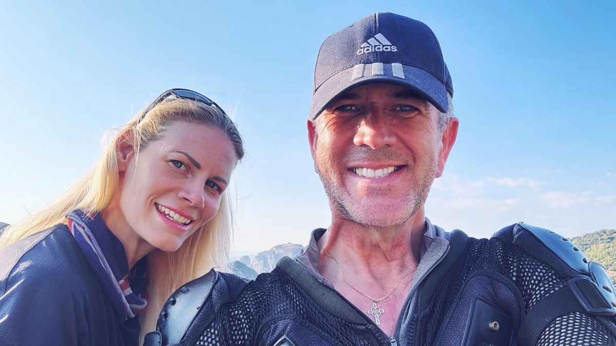 Rag in baseball hat making a selfie with SophieS who is more sideways in the picture wearing a blue top.