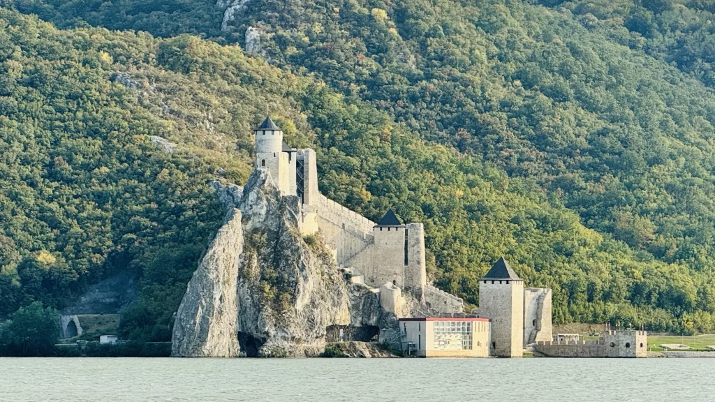 A view of a strange castle like building set agains the Danube in Romania which over looks Serbia