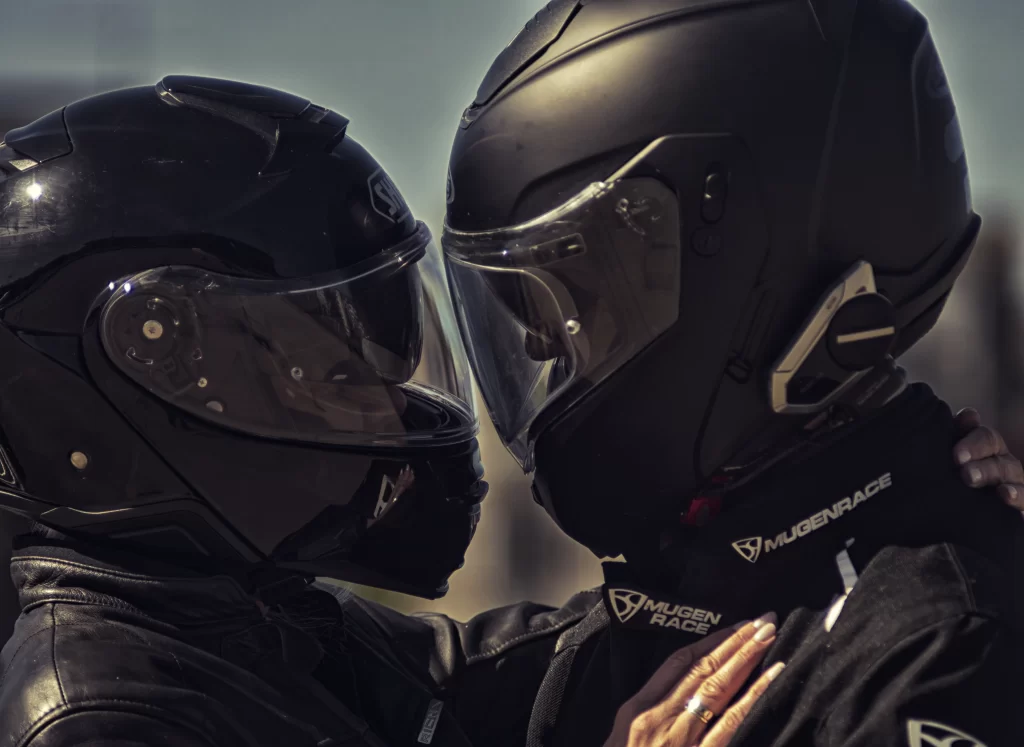 SophieS and Rag in their helmets lovingly looking at each other while their forehead is touching.